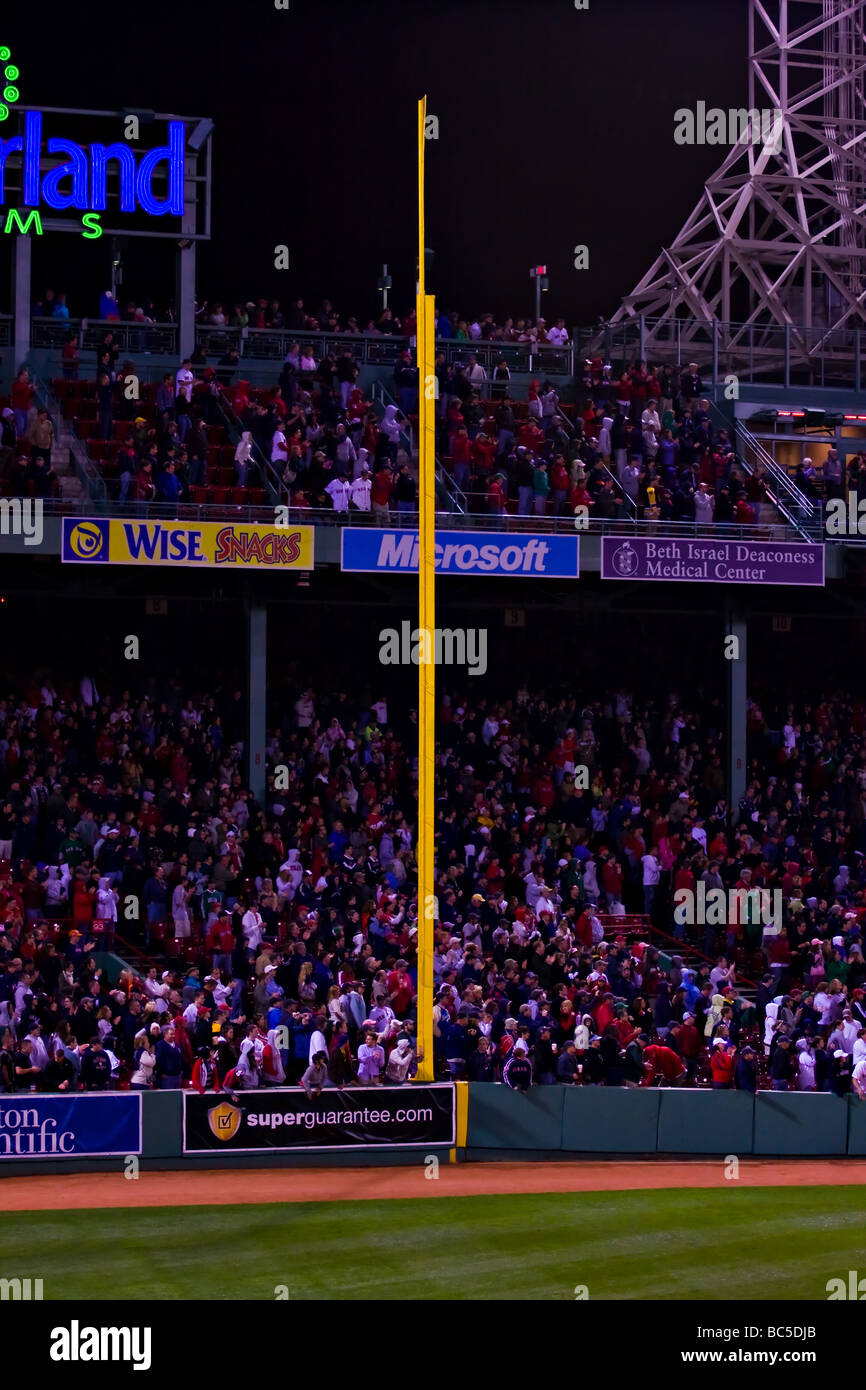 Boston Massachusetts.  Fenway Park at night.  Right Field foul pole nicknamed the Pesky Pole after Red Sox player Johnny Pesky. Stock Photo