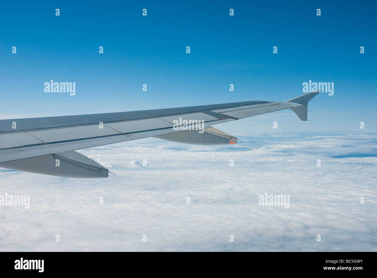 View of aircraft wing whilst in flight at altitude Stock Photo - Alamy