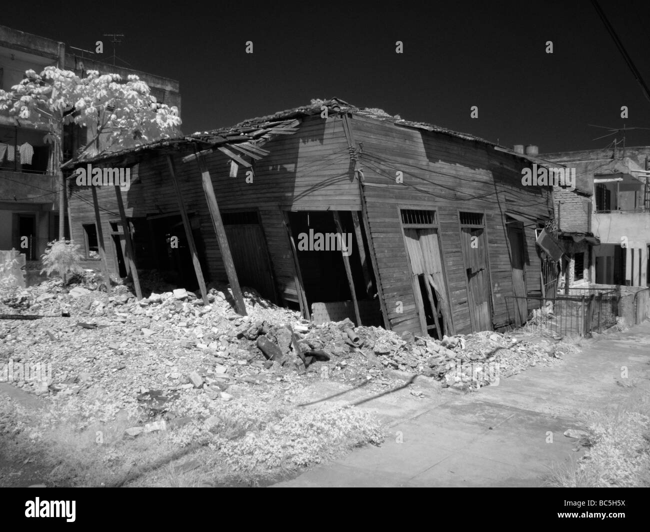 Leaning old damaged home in Lawton area of Havana Cuba Habana Stock Photo