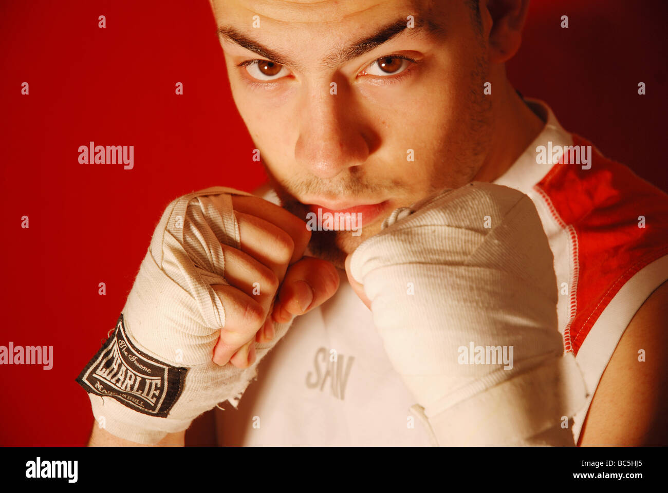 Portrait of young man boxing and looking at the camera. Close up. Stock Photo