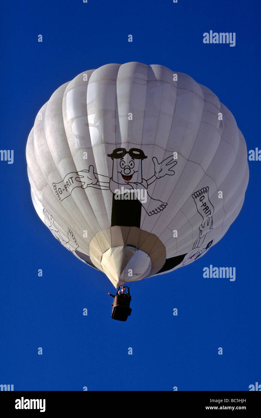 Hot air balloon isolated against a deep blue sky backdrop Stock Photo ...