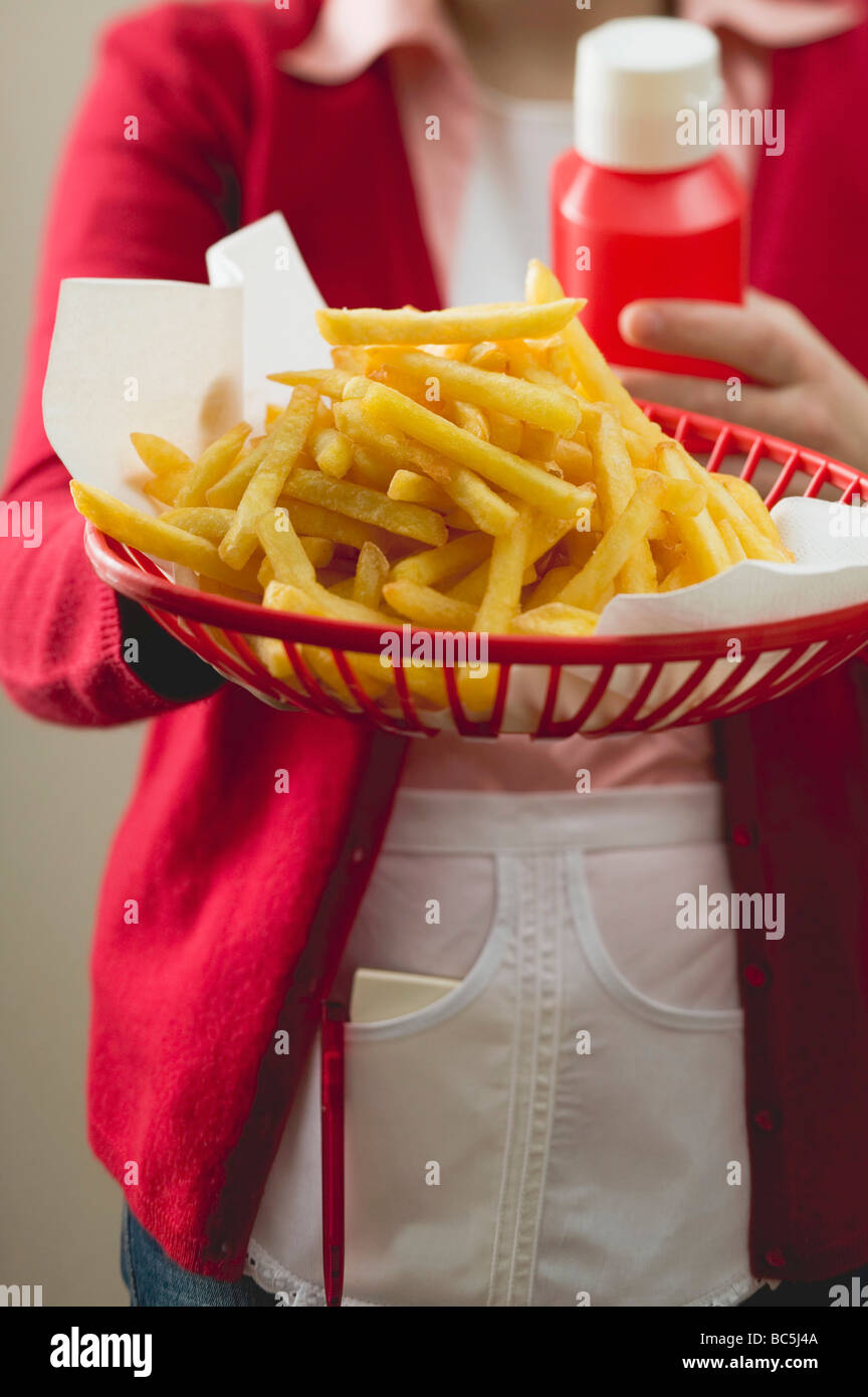 Chips in plastic basket Stock Photo Alamy