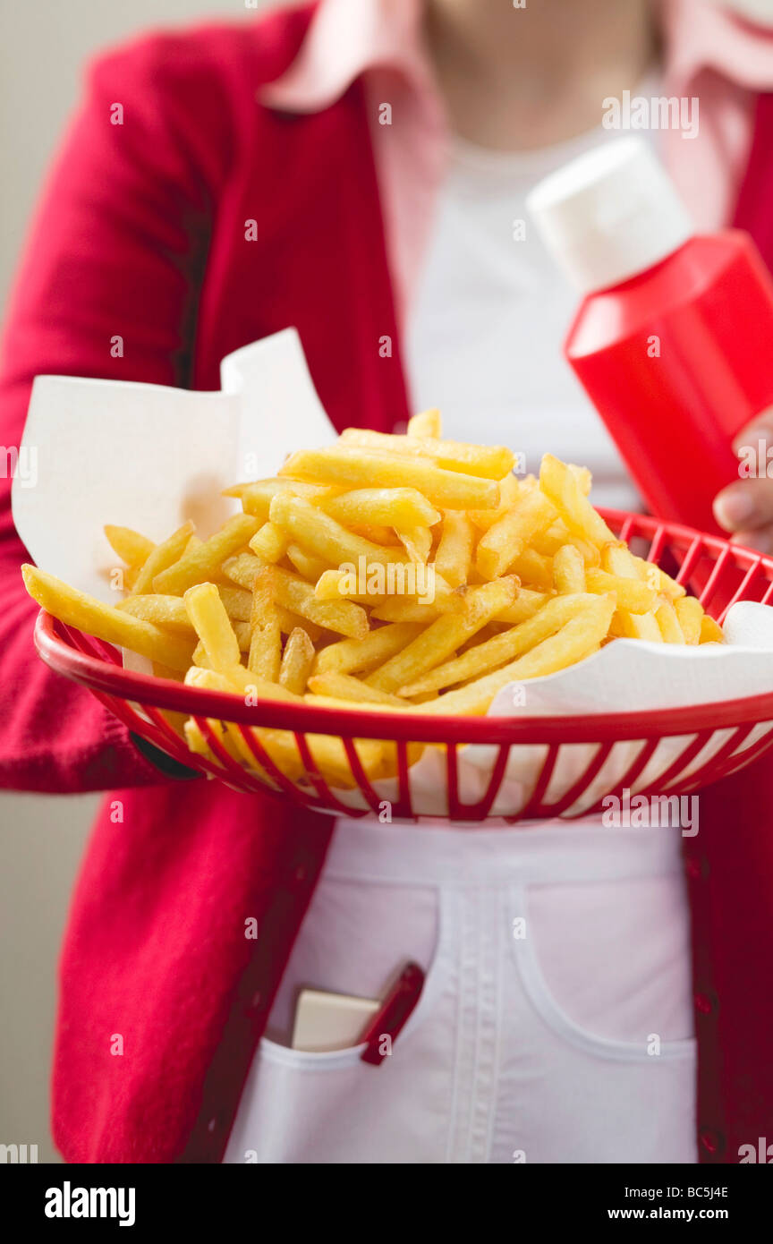Chips in plastic basket Stock Photo Alamy