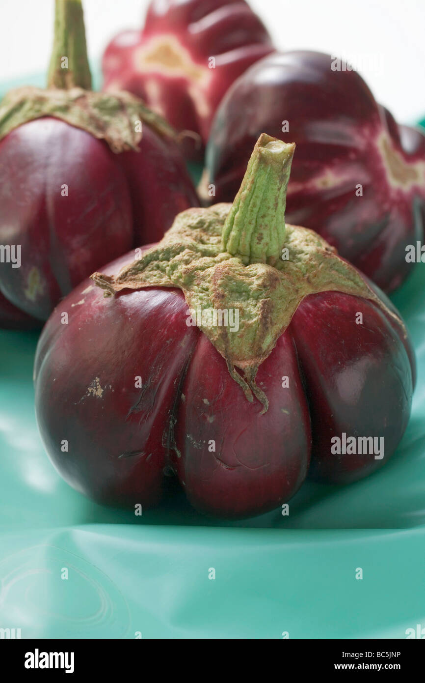 A few baby aubergines Stock Photo - Alamy