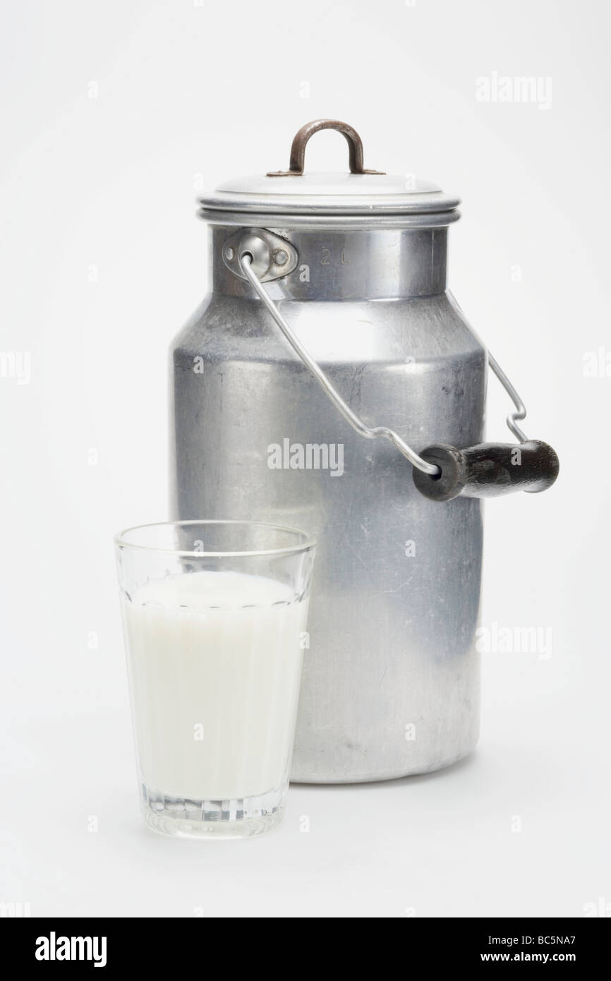 A milk can and a glass of milk Stock Photo Alamy