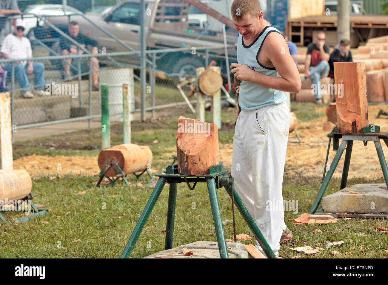 wood chopping competition with axemen in standing and upright competition Stock Photo