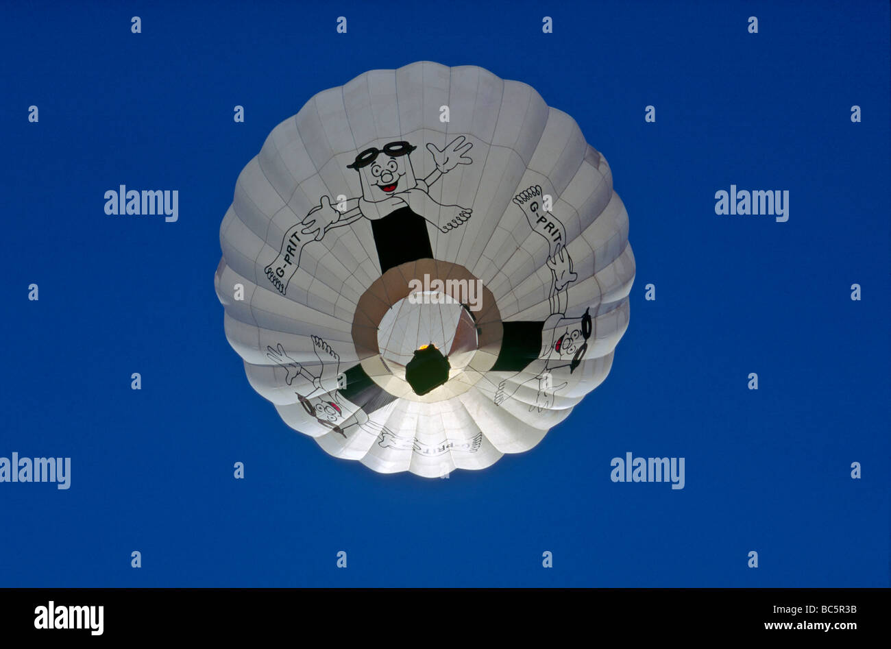 Hot air balloon isolated against a deep blue sky backdrop Stock Photo ...