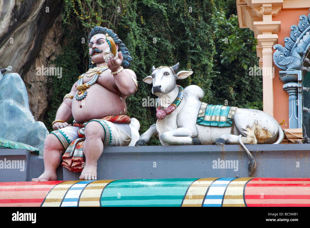 Statues on the Hindu temple at the base of the steps, Batu Caves, Kuala Lumpur, Malaysia Stock Photo
