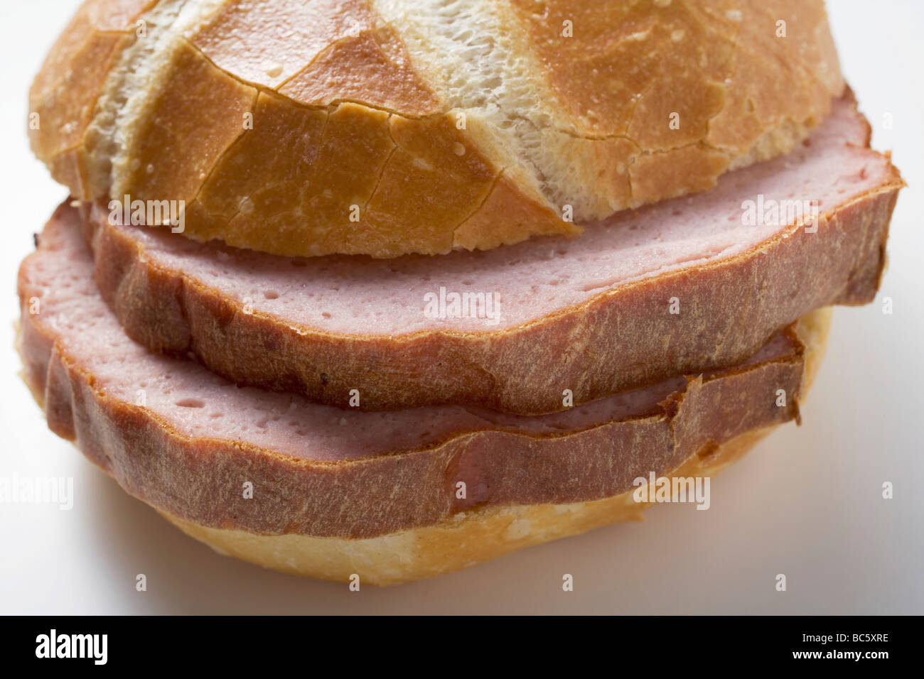 Slices of Leberkäse (a type of meatloaf) in a roll Stock Photo - Alamy