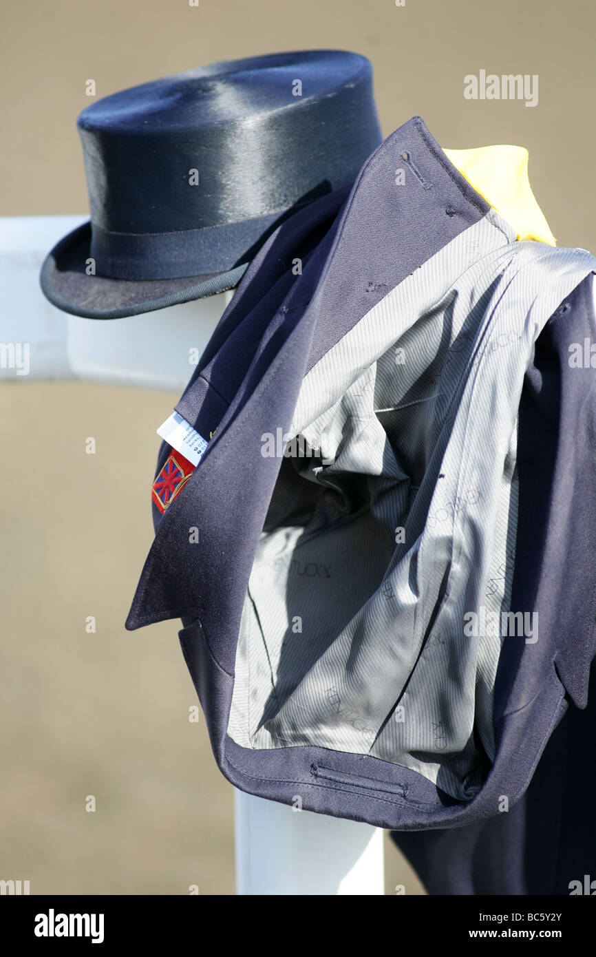 Dressage hat and jacket in equestrian arena Stock Photo Alamy