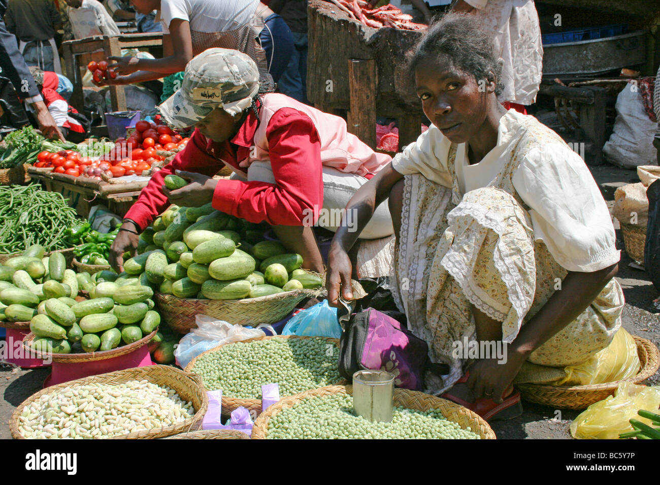 Selling Fruit and Vegetables on Her Market Stall In Antananarivo, Madagascar Stock Photo