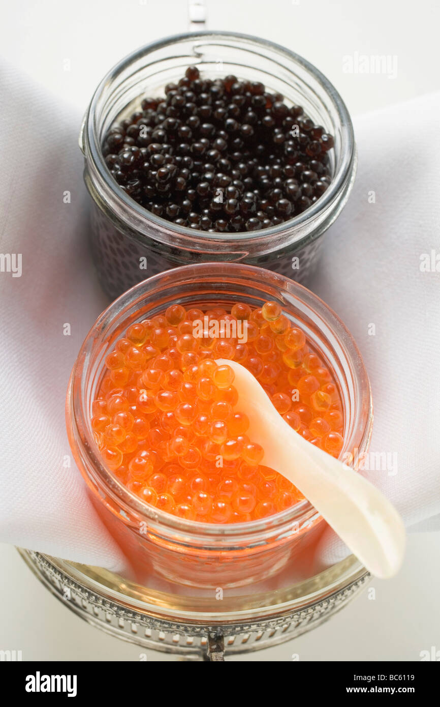 Black caviar and keta caviar in jars hi-res stock photography and ...