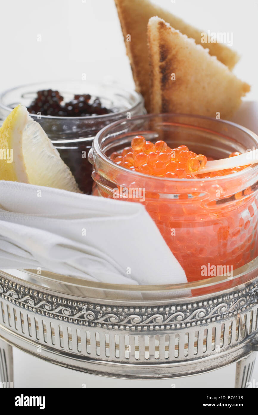 Black caviar and Keta caviar in jars, toast Stock Photo Alamy