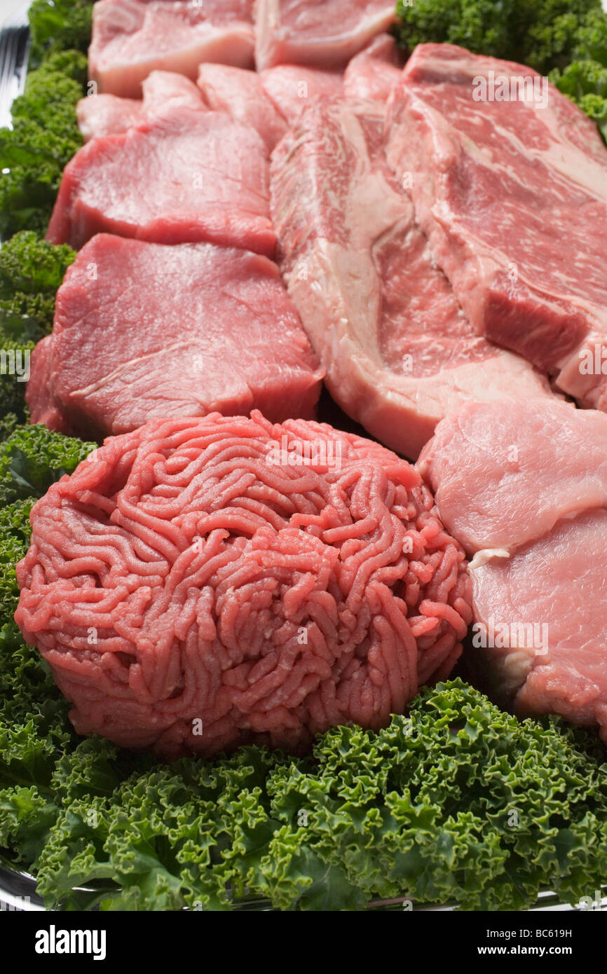 various-types-of-meat-surrounded-by-parsley-stock-photo-alamy