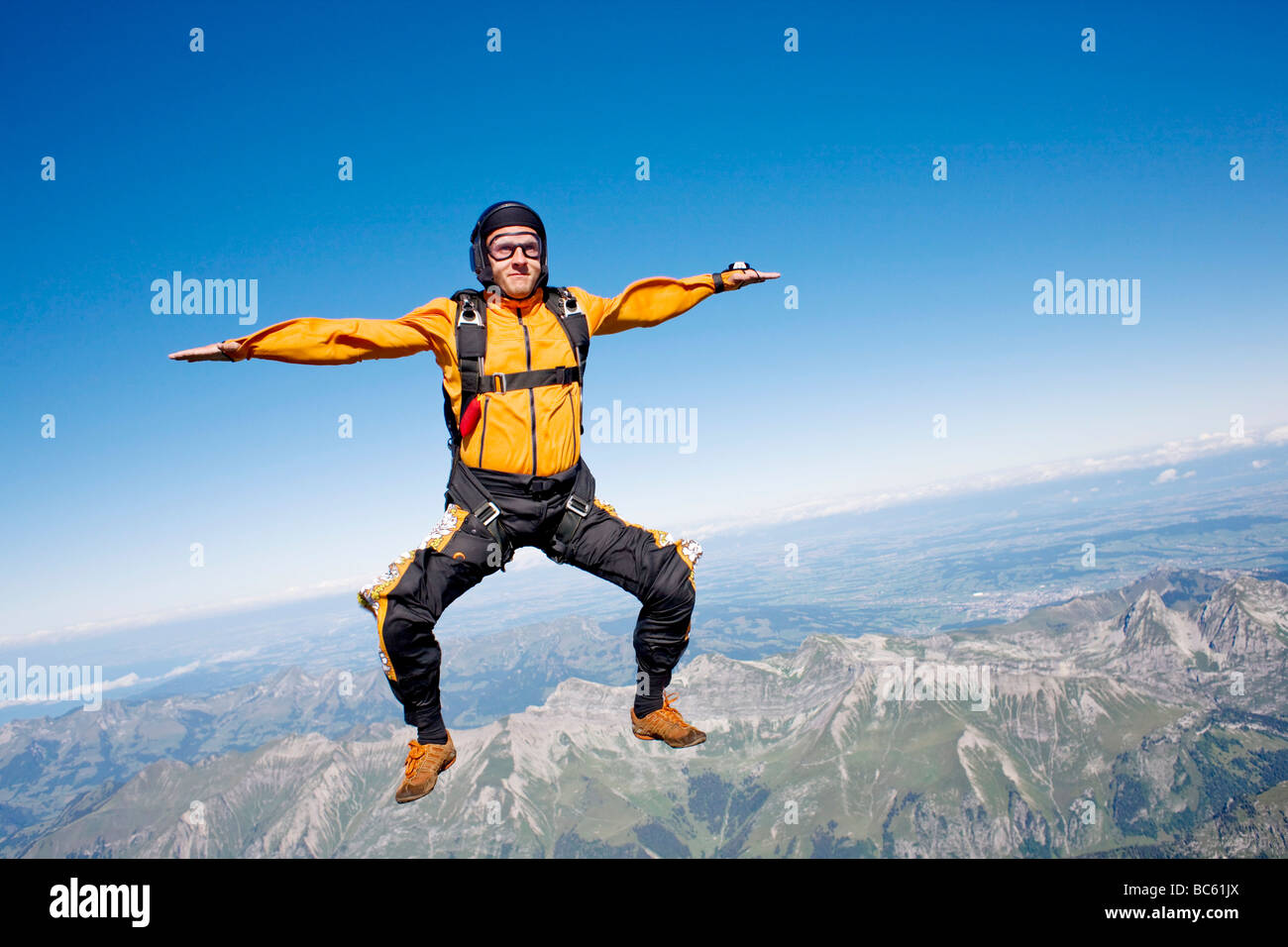 Parachutist in free fall, Switzerland Stock Photo