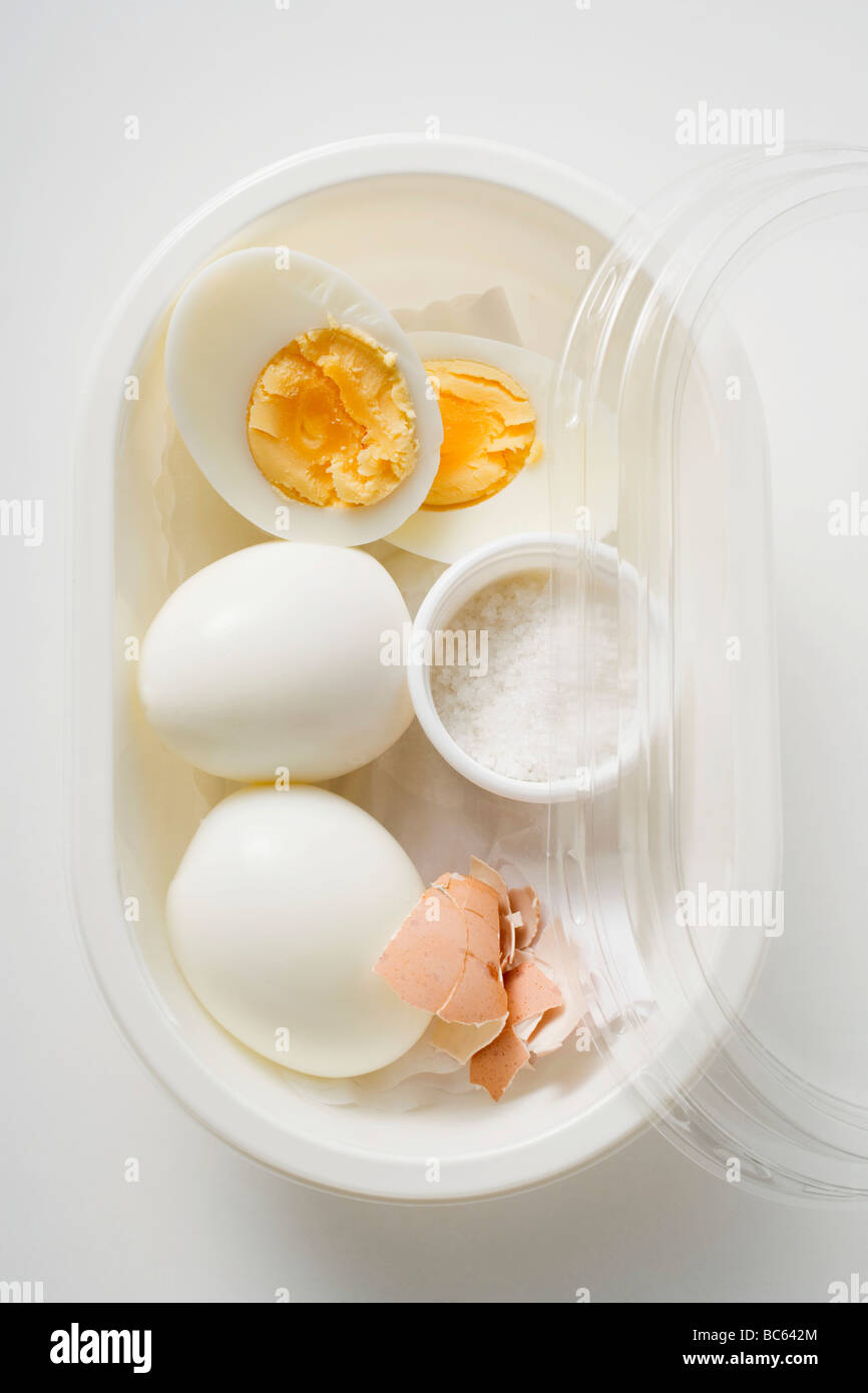 Boiled eggs and salt in plastic food storage container Stock Photo Alamy