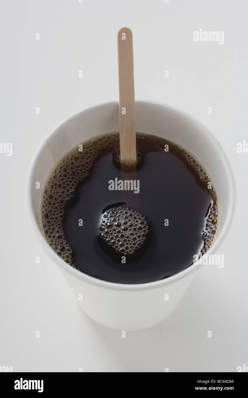 Black coffee in paper cup with wooden stirrer Stock Photo - Alamy