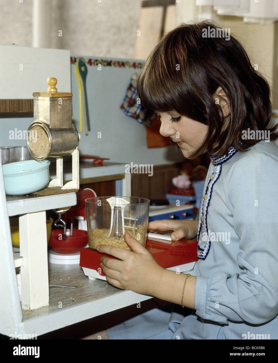 people, children, playing, girl is playing with dolls kitchen, 1970s, , Stock Photo