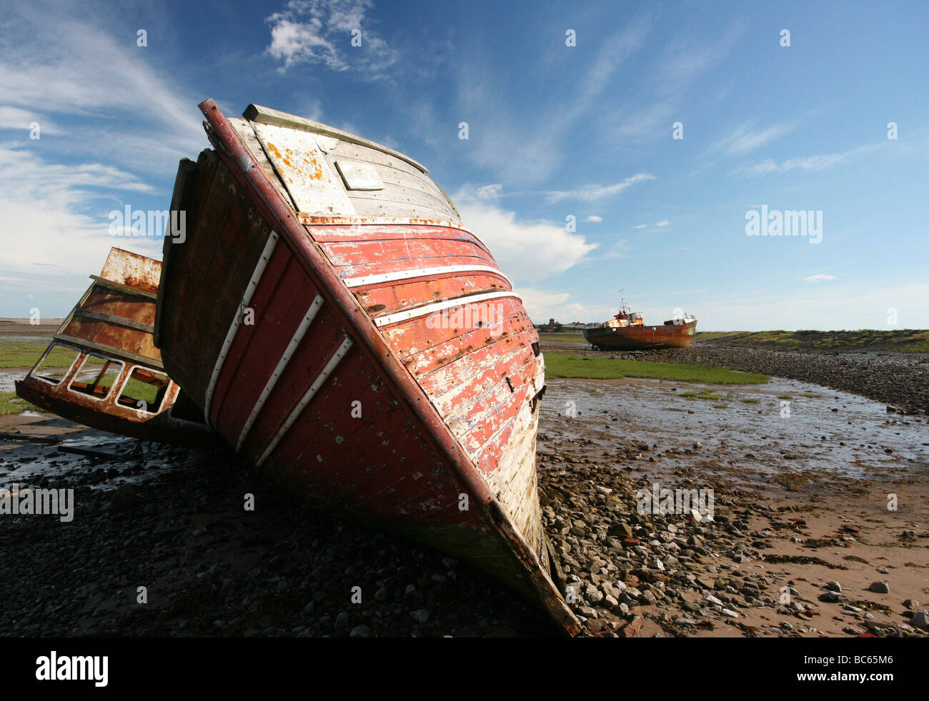 Derelict and wrecked fishing boats on the shore at BarrowinFurness
