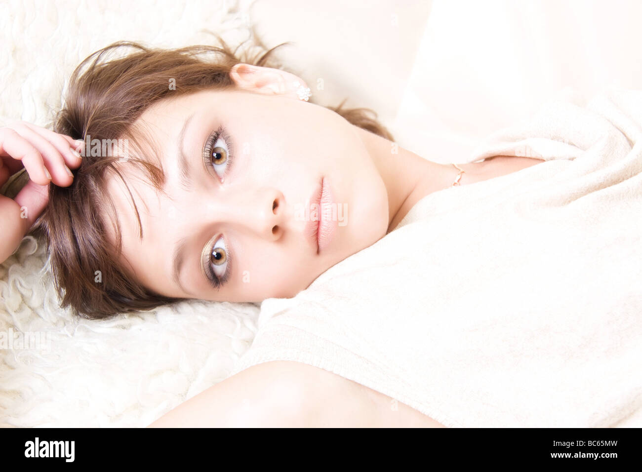 Resting woman portrait Bright lighting without shadows Stock Photo