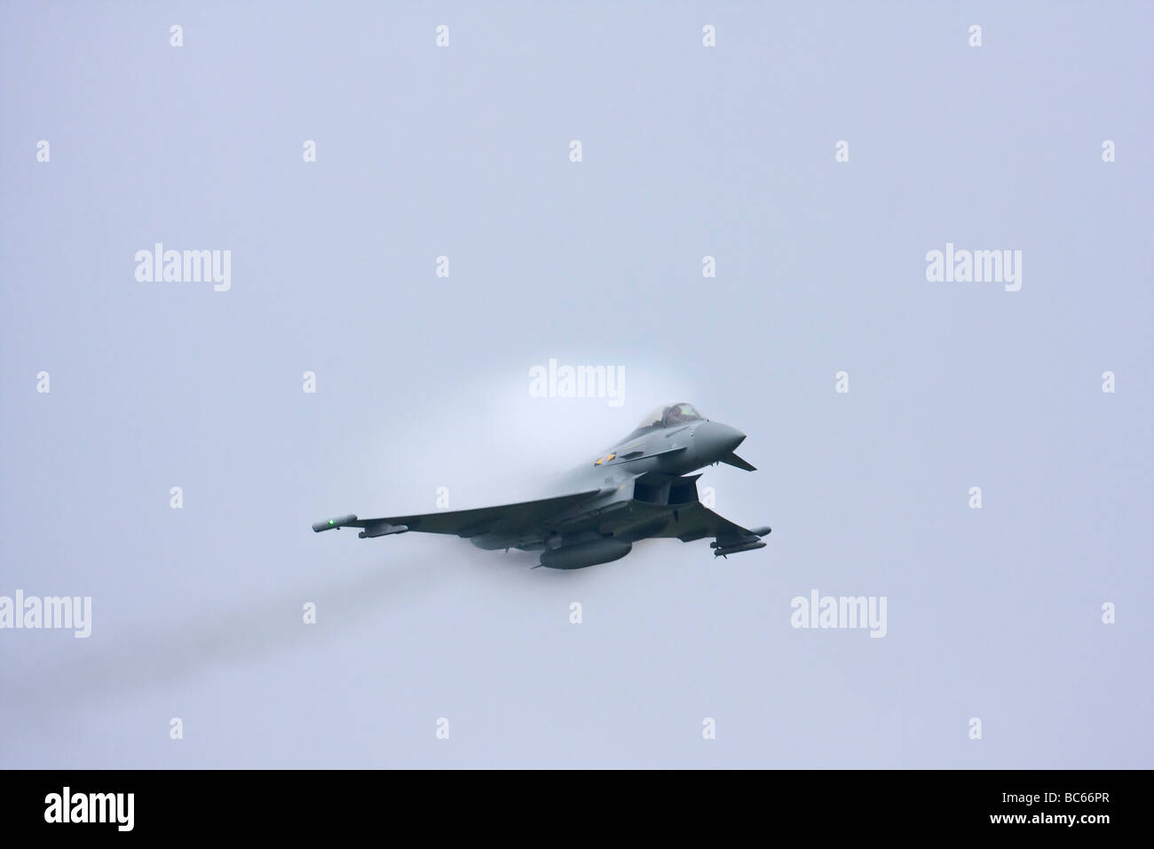 RAF Eurofighter Typhoon bursting through condensation cloud Stock Photo
