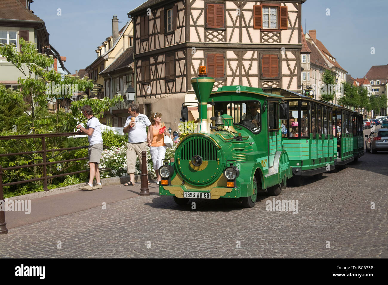 Colmar Alsace France EU Tourist train taking visitors along Rue Saint Jean  on a tour of Little Venice area Stock Photo - Alamy
