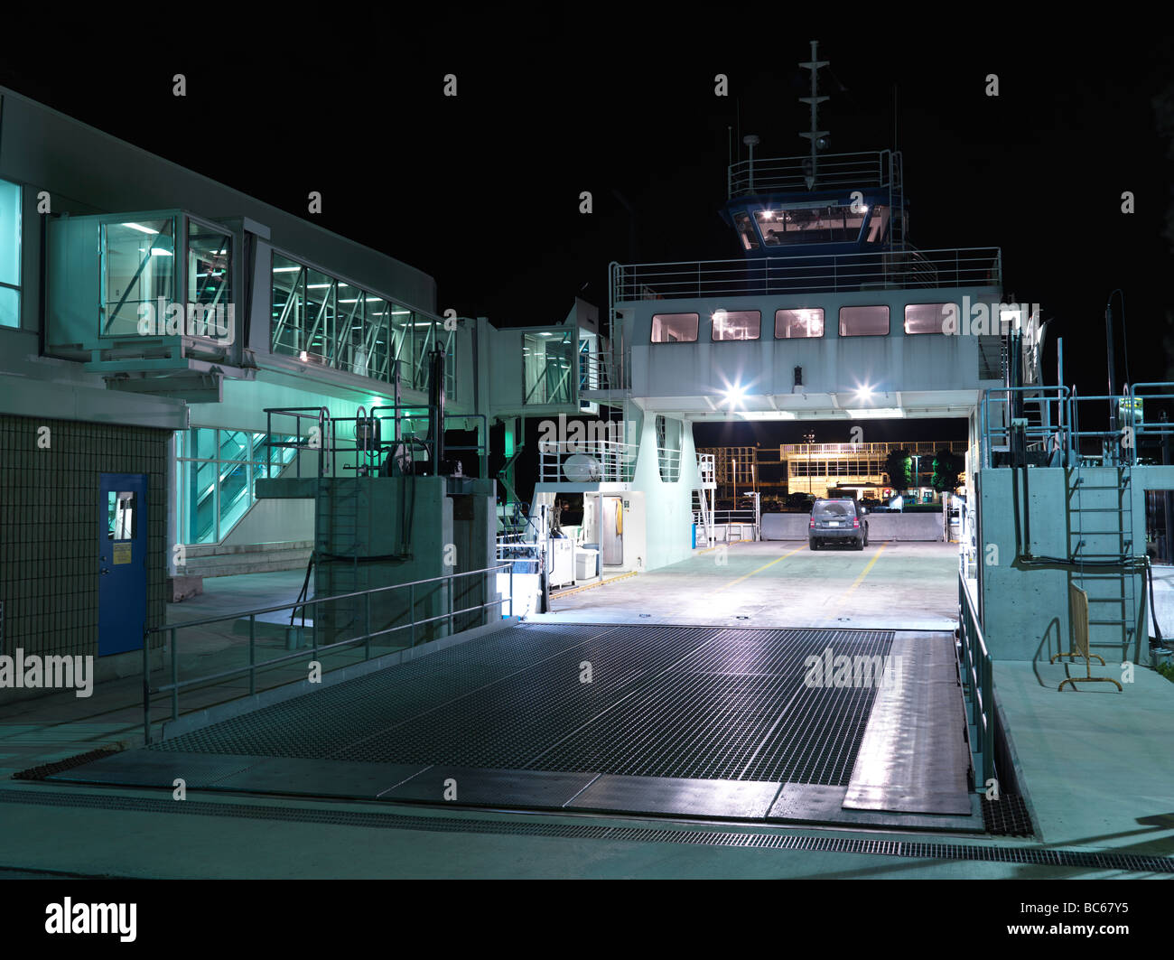 Toronto Island Airport ferry at a terminal at night Stock Photo