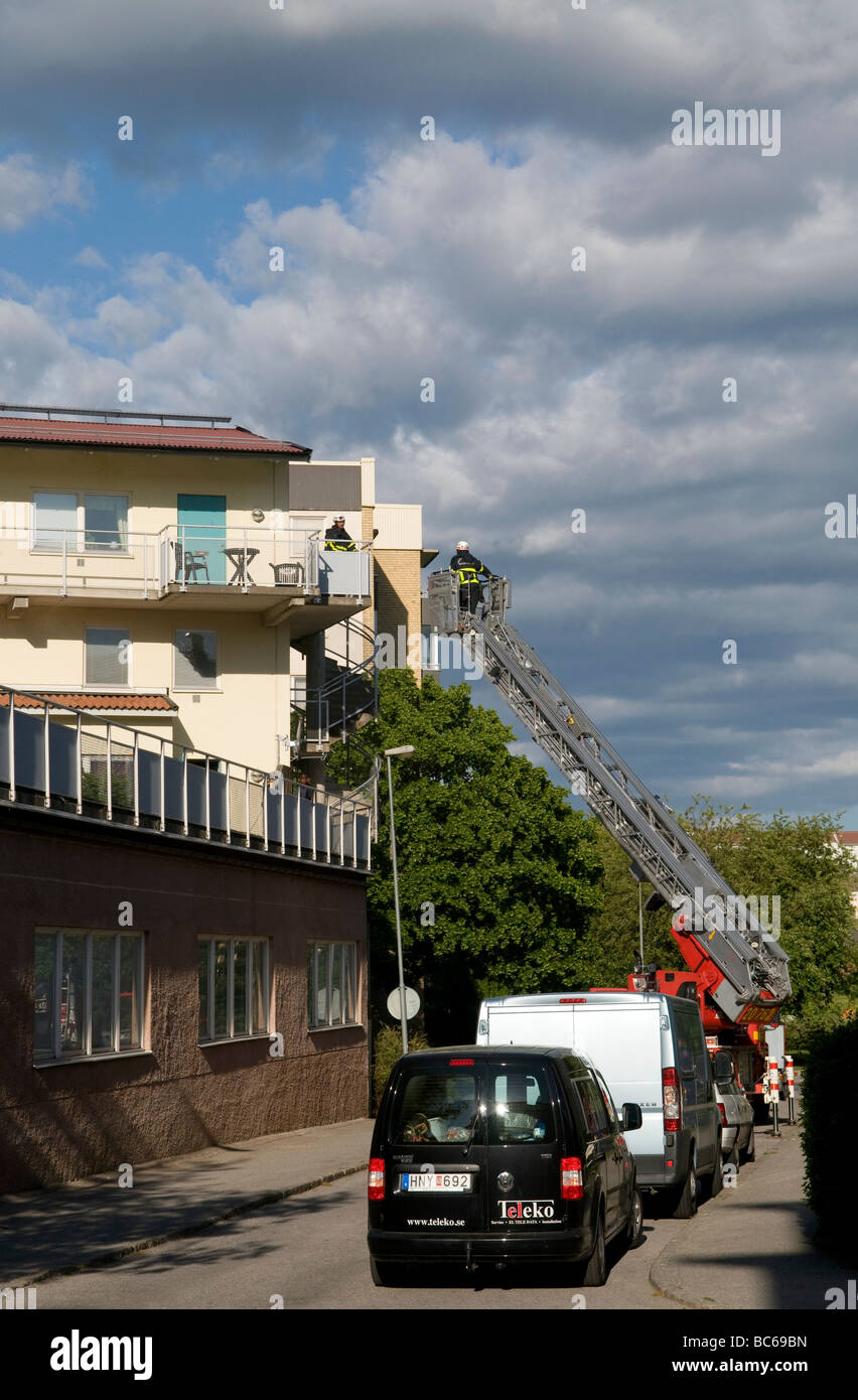 Fire brigade investigating a fire in flats in åkersberga, outside Stockholm, Sweden. Stock Photo