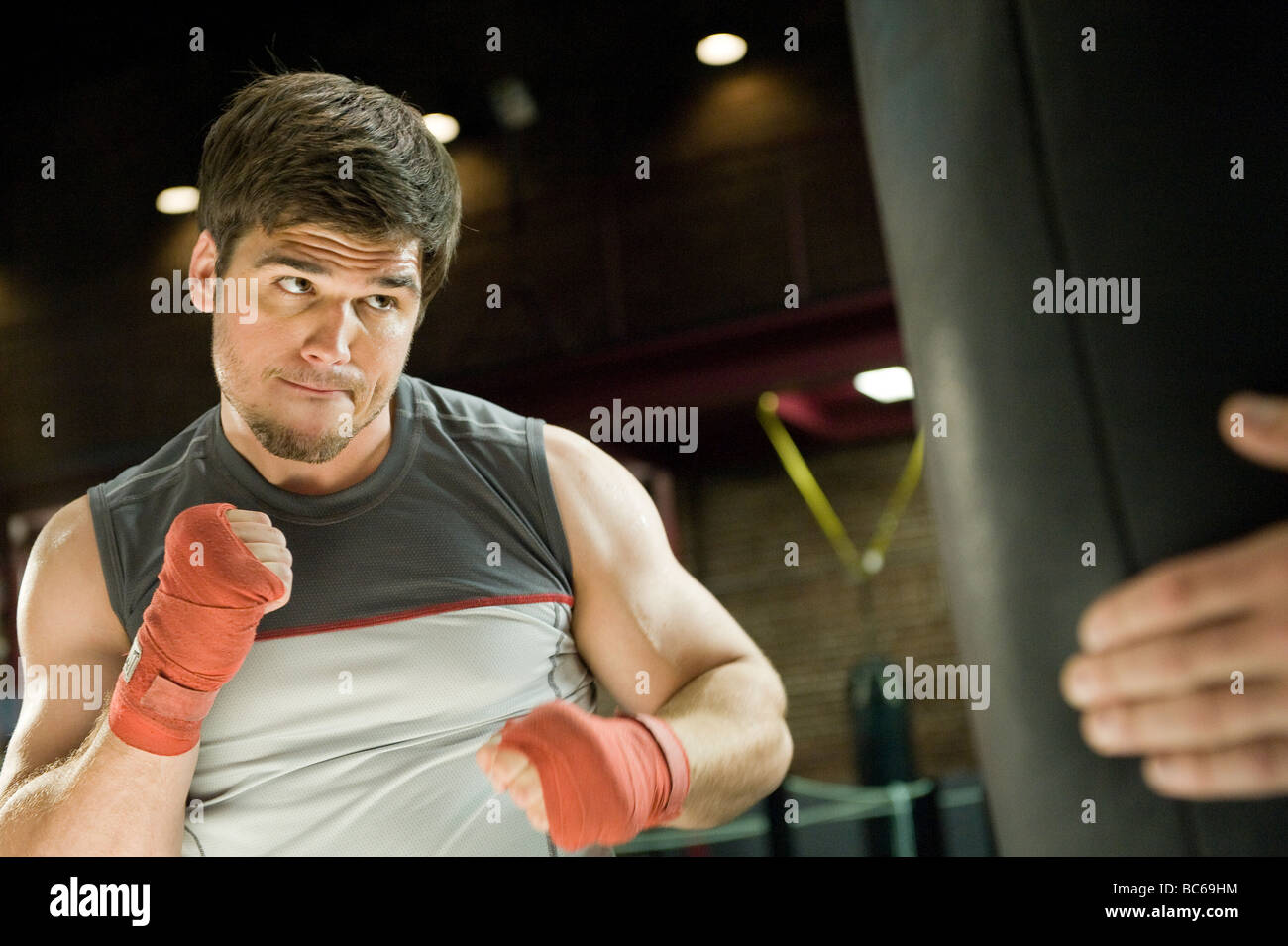 A male boxer training on a punching bag Stock Photo - Alamy