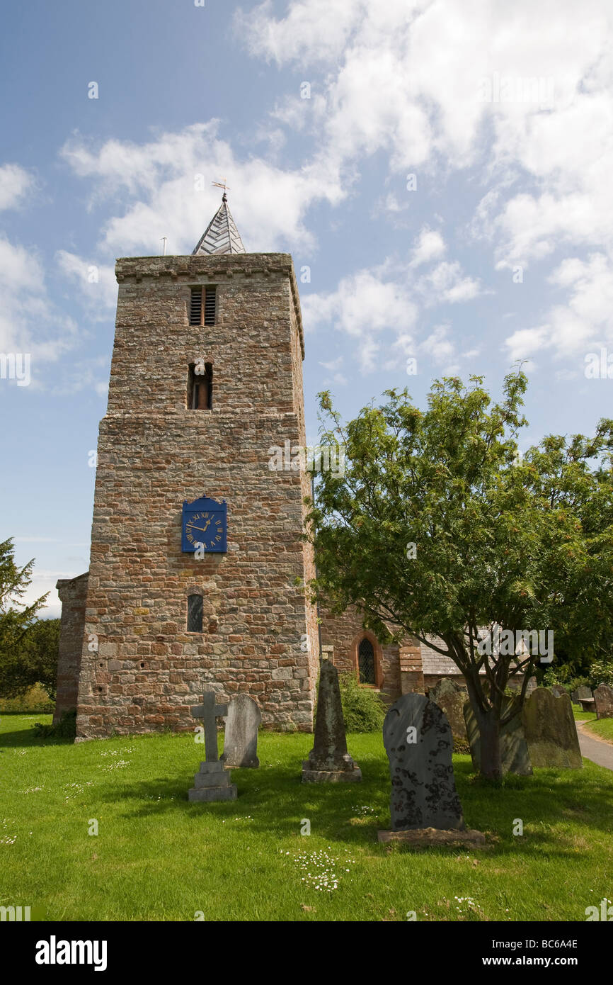 St Laurence Saxon Church showing clock tower and churchyard, Morland Cumbria UK Stock Photo