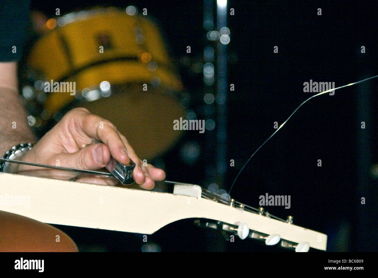 Closeup of Son Henry playing the Slide Guitar during the live Blues bonanza performance in The Town bar in Dundee,UK Stock Photo