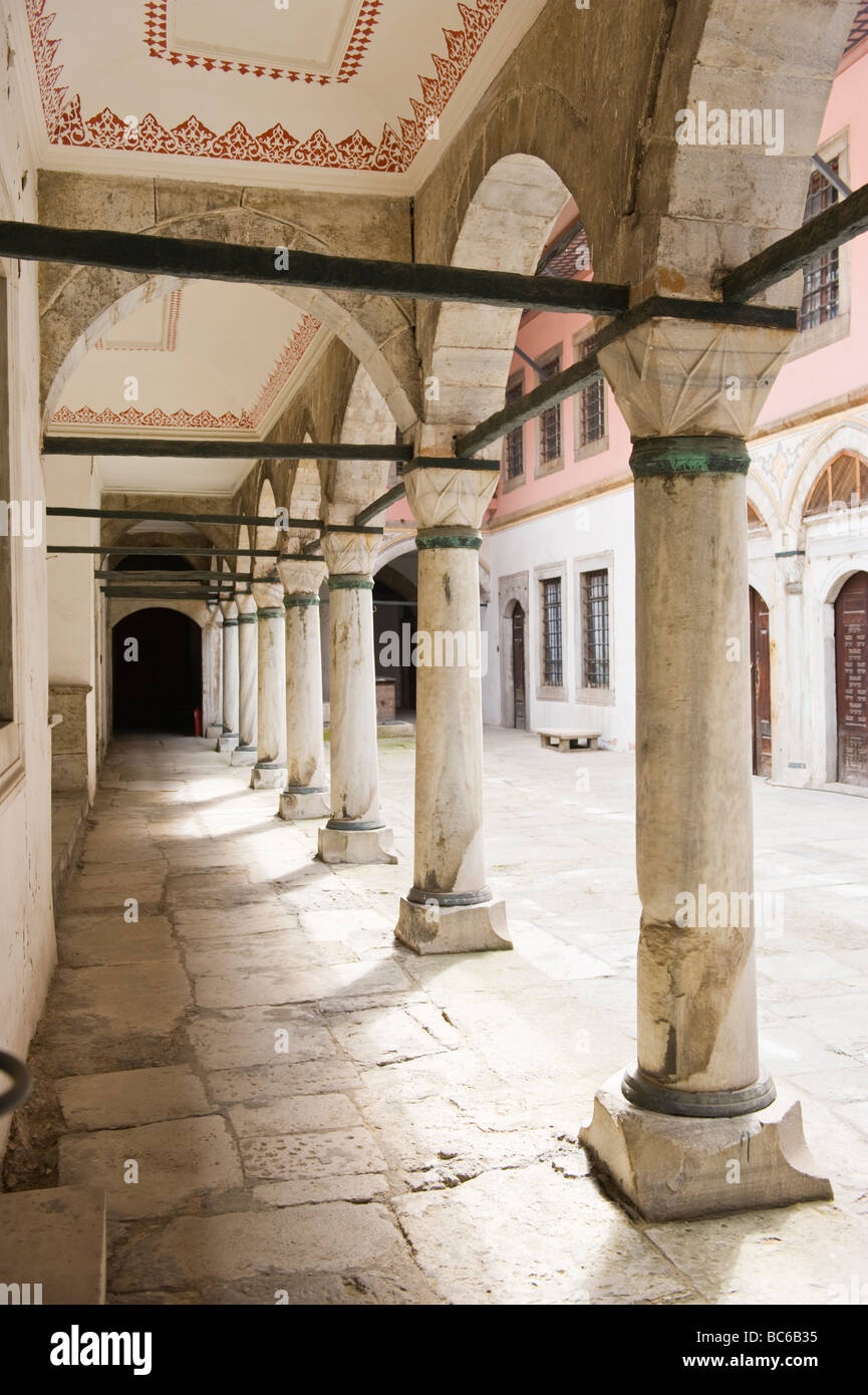 Turkey , Istanbul , Topkapi Palace , Inner courtyard in Harem with colonnade & ornate decorated arches Stock Photo