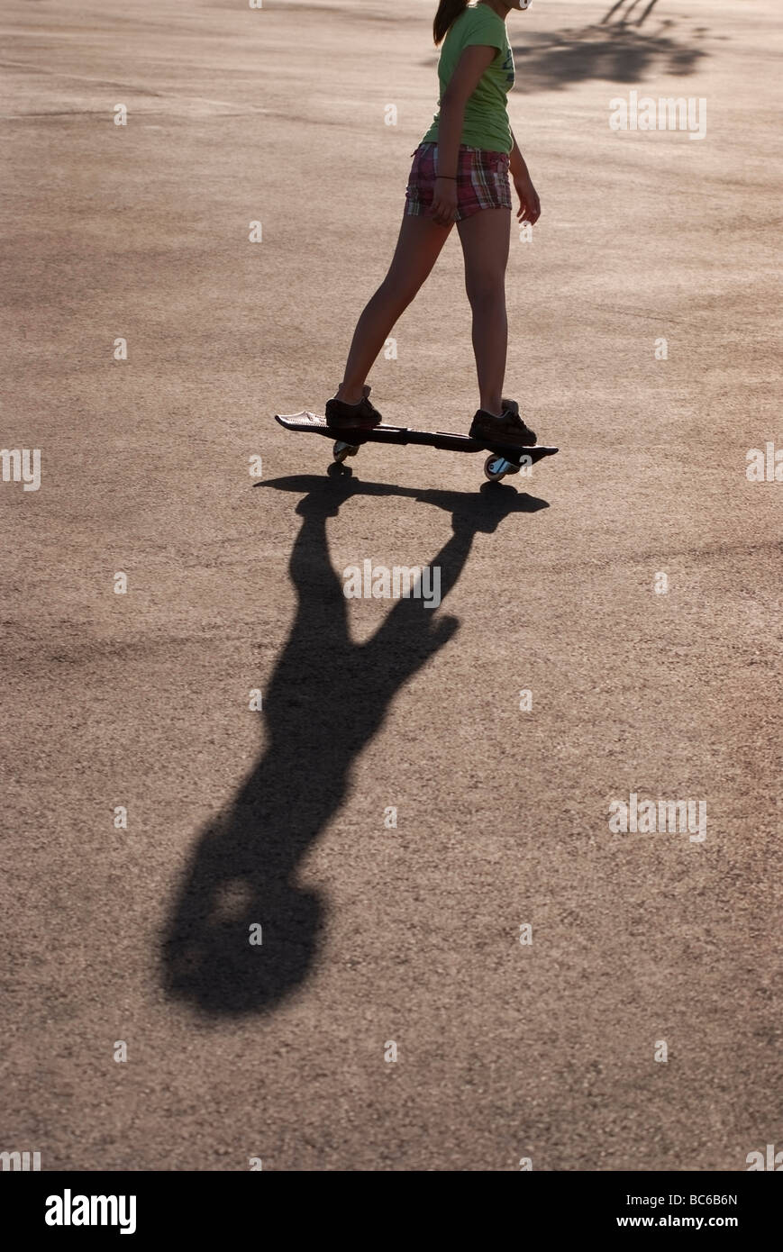 12 yearold Caucasian girl using a Ripstik or a modern version of a