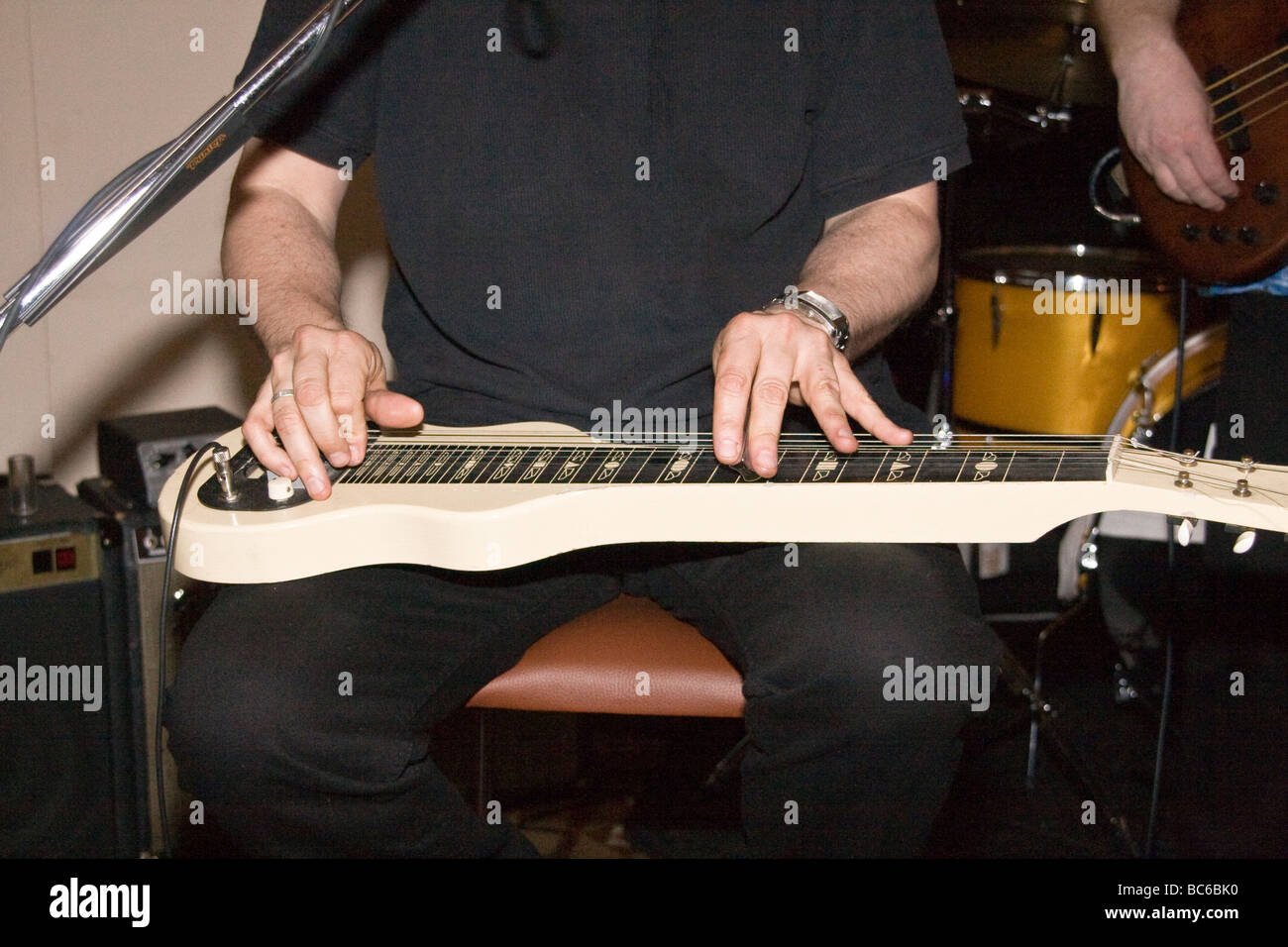 Son Henry playing his Lap Steel Guitar during the live Blues bonanza 2009 performance in Dundee Stock Photo