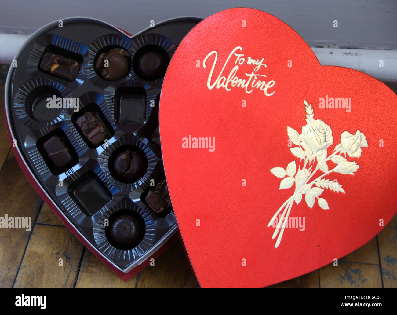 Box of valentine's day chocolates, some of which have been eaten. Stock Photo