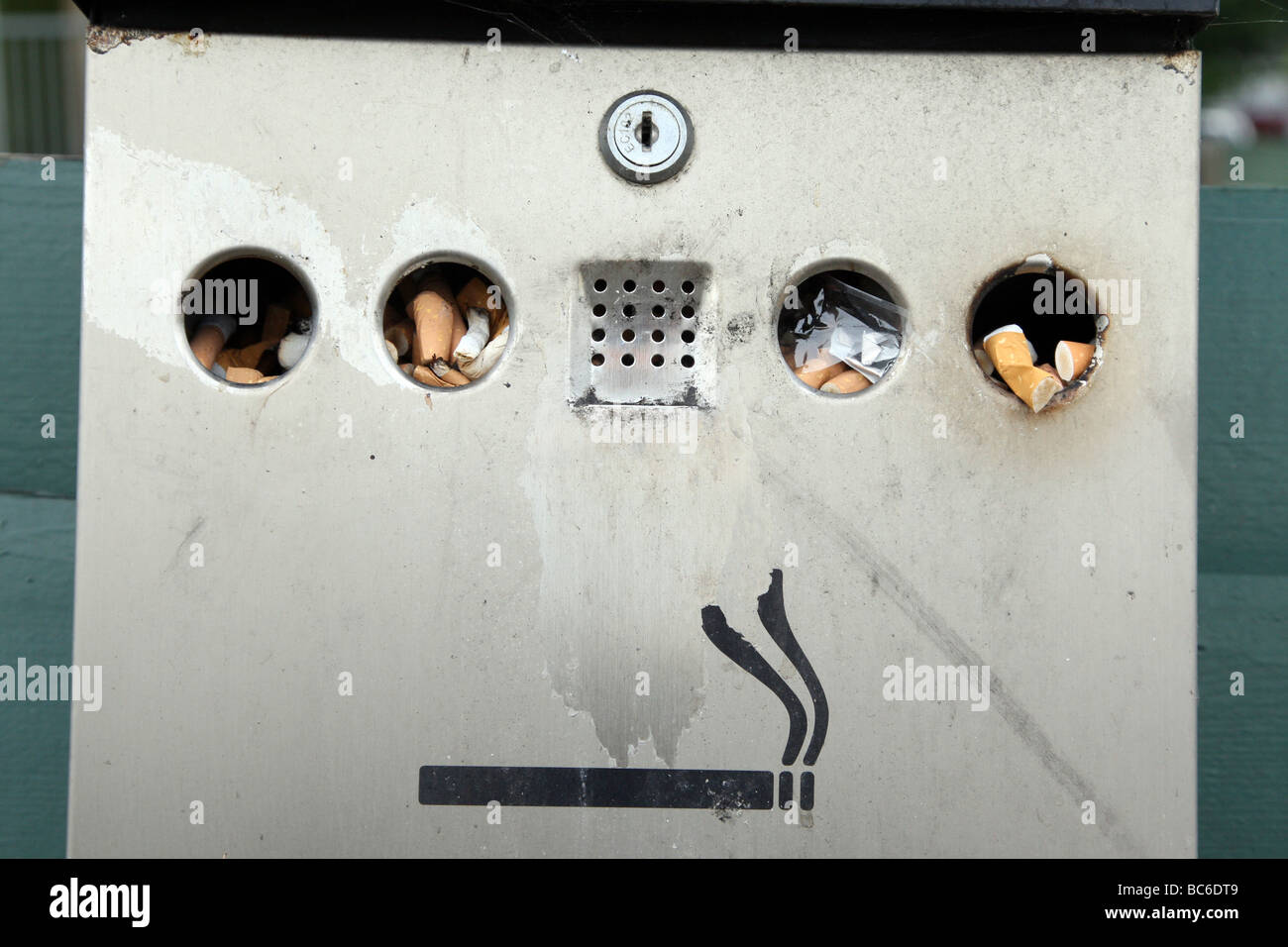Cigarette butts in a disposal unit Stock Photo