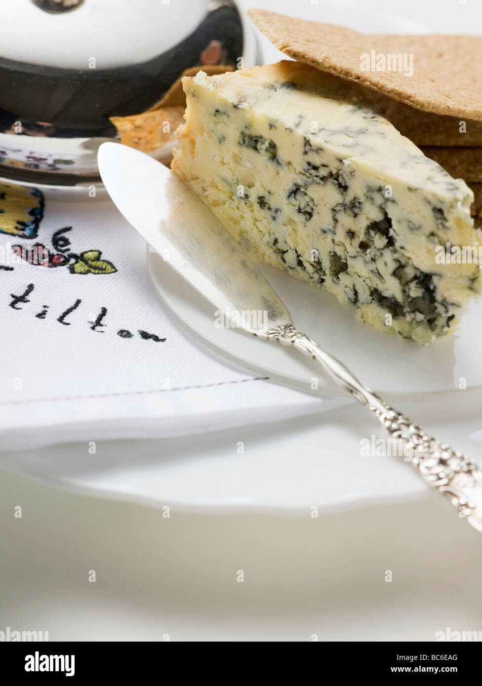 Wedge of Stilton with crackers and cheese knife Stock Photo Alamy
