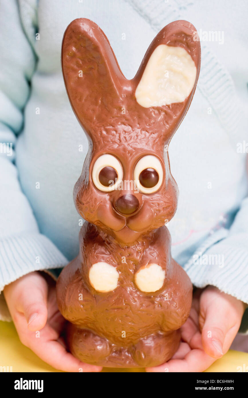 Child Holding Large Chocolate Easter Bunny Stock Photo Alamy Child holding large chocolate easter bunny stock photo alamy