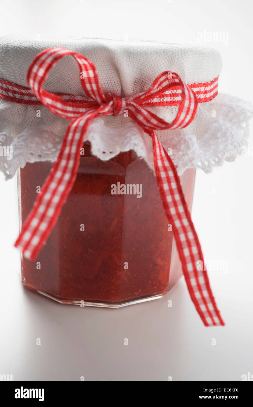 Jar of strawberry and rhubarb jam - Stock Photo