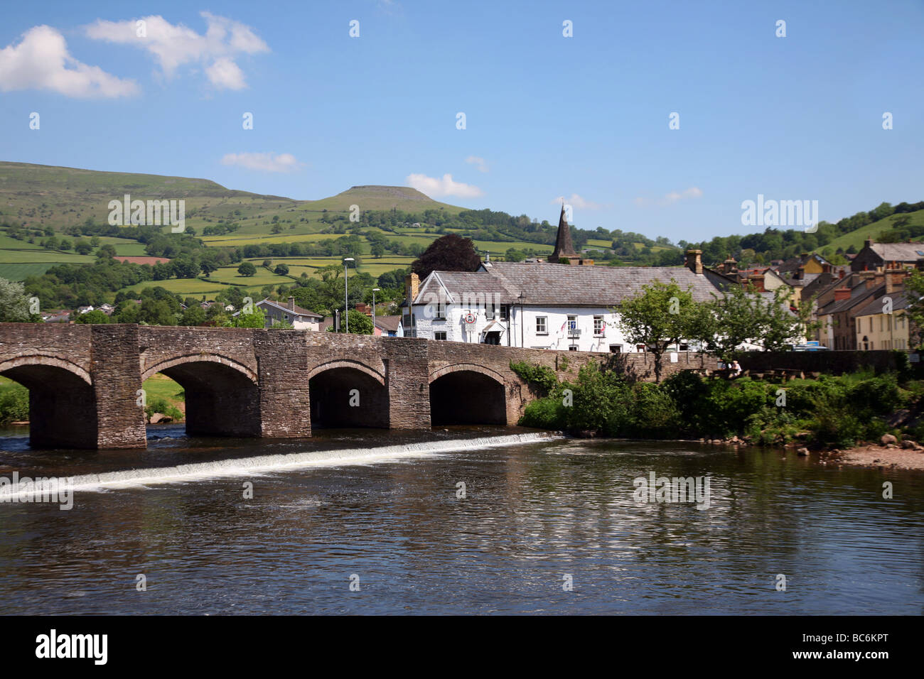 Stone bridge crossing the River Usk in the popular town of Crickhowell Stock Photo