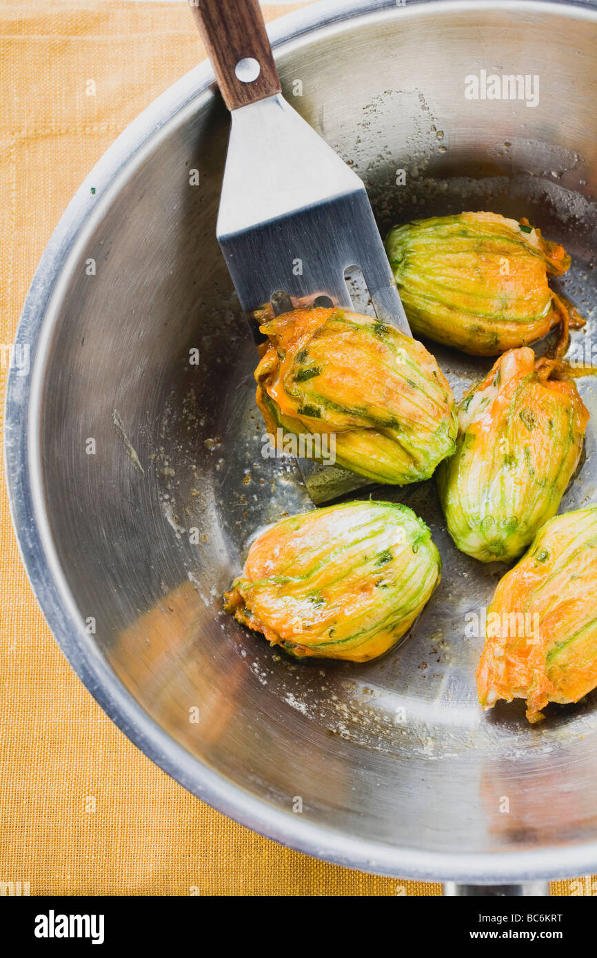 Fried courgette flowers in pan (overhead view Stock Photo Alamy
