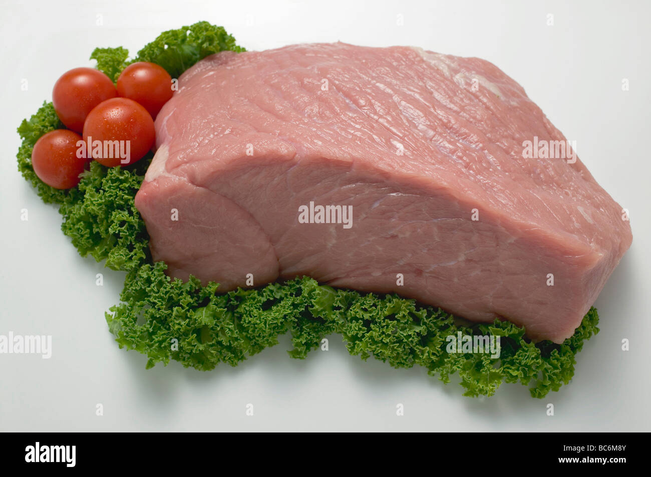 Fresh veal with garnish - Stock Photo