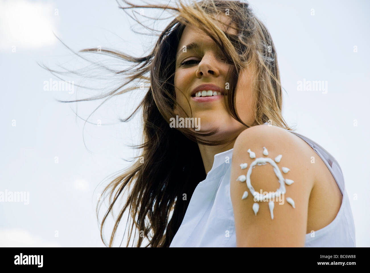 Young woman sunbathing in meadow Stock Photo Alamy