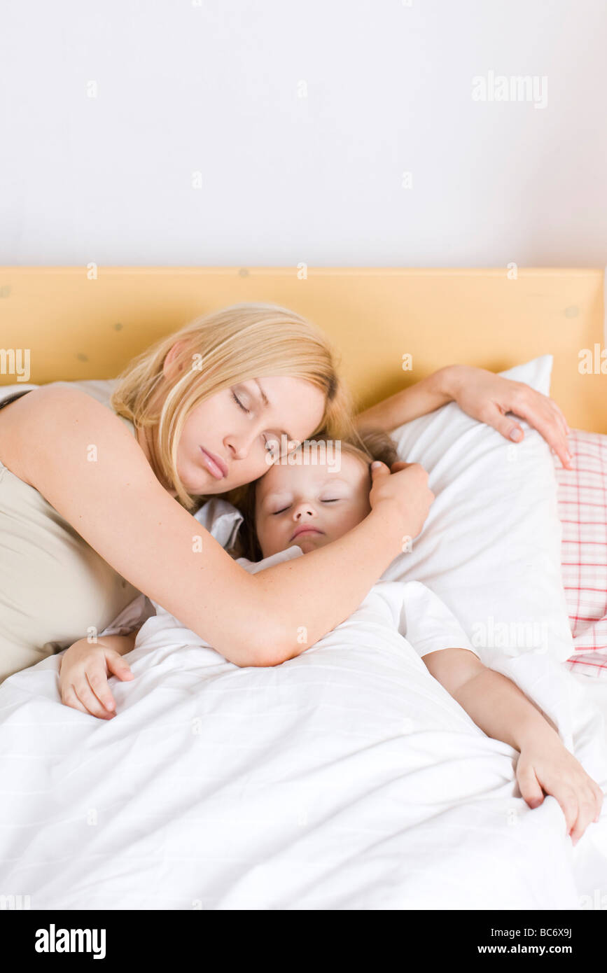 mother and baby sleeping together in bed Stock Photo - Alamy