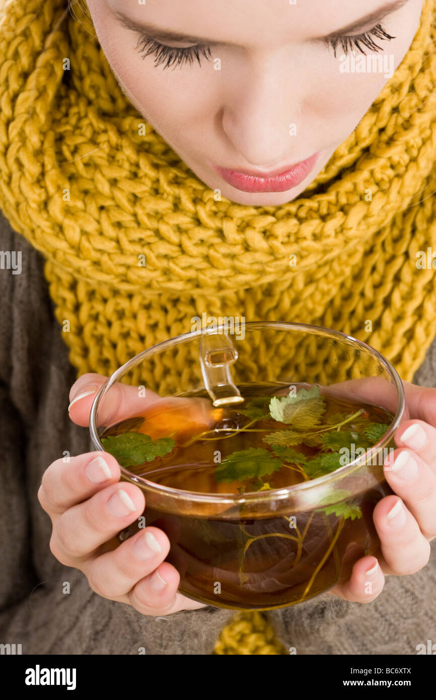 young woman drinking tea Stock Photo Alamy