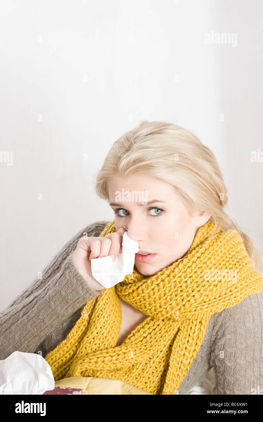 sick woman with tissue Stock Photo Alamy