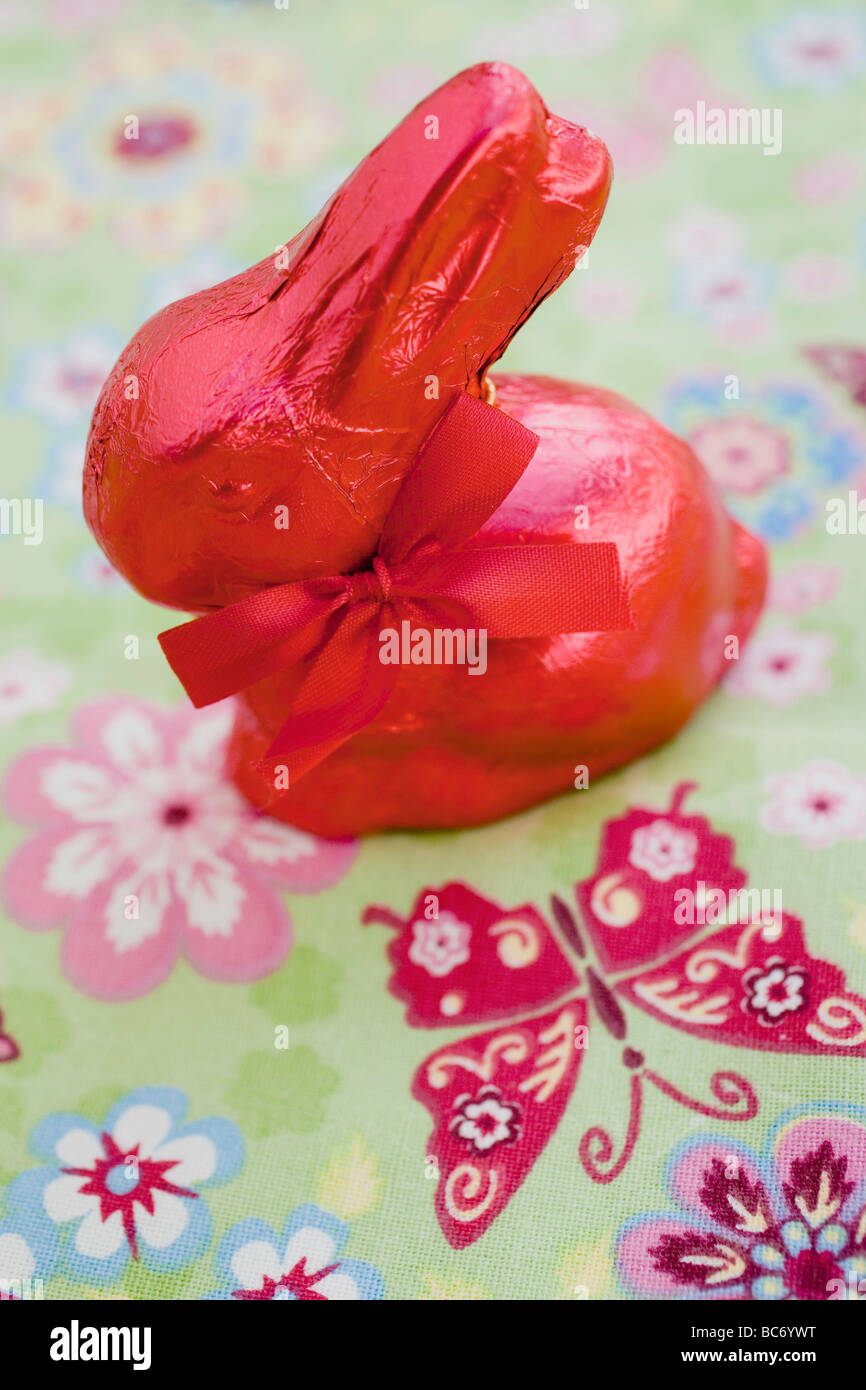 Red Easter Bunny on coloured cloth - Stock Photo