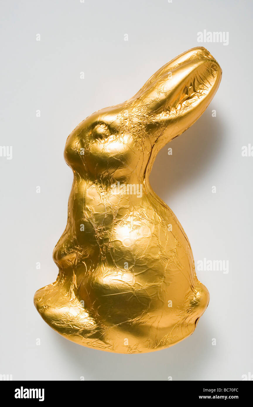 Chocolate bunny in gold foil - Stock Photo