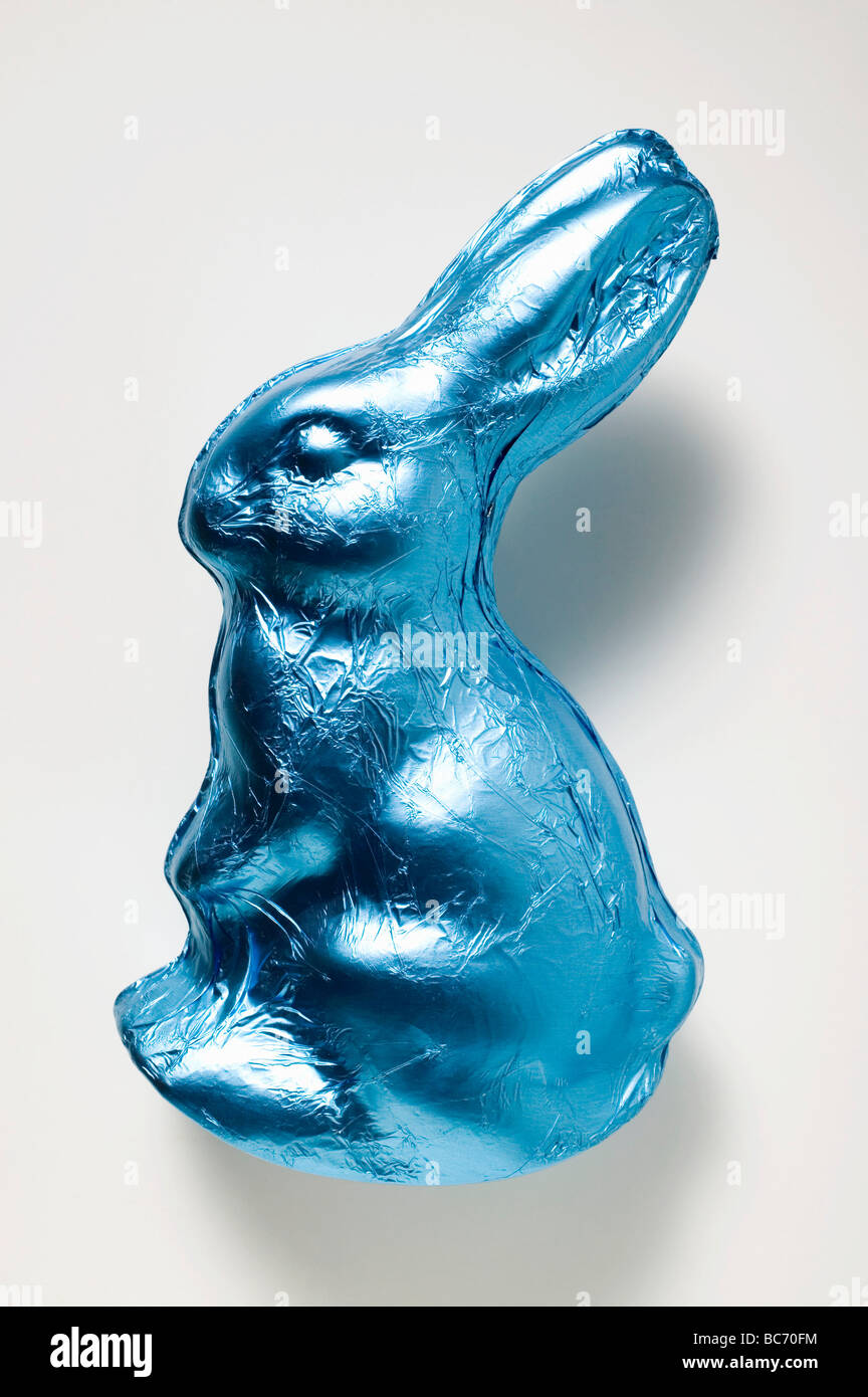 Chocolate bunny in blue foil - Stock Photo
