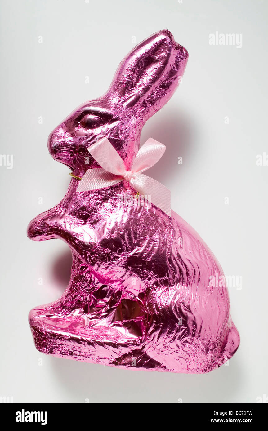 Chocolate bunny in pink foil - Stock Photo